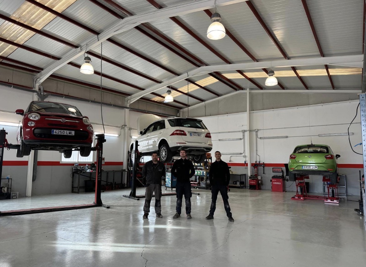 Mechanics working inside the Motorworks workshop
