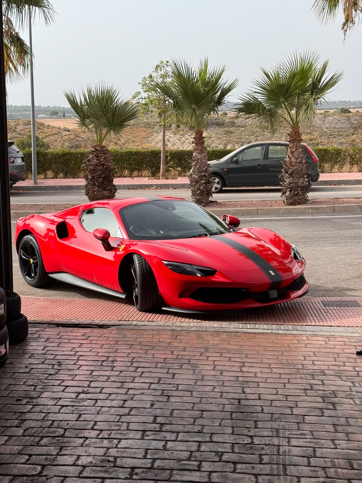 Ferrari 296 outside the workshop